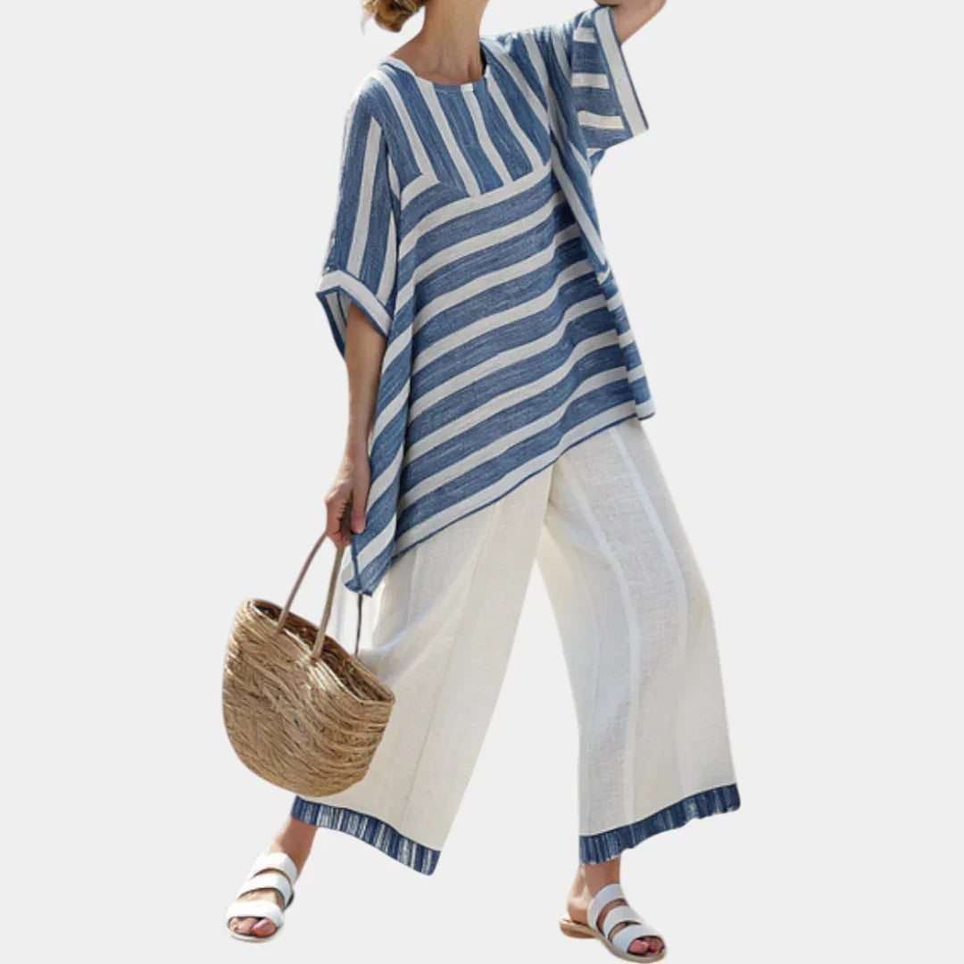 Ornela | Sophisticated blue striped top and trousers with details at the hem.