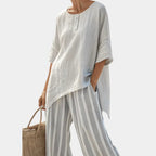 Fiorella | Elegant asymmetrical blouse and striped trousers