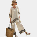 Mariella | Elegant black striped top and flowing trousers