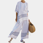 Vittorina | Asymmetrical top with sophisticated stripes and bold trousers.