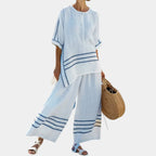 Vittorina | Asymmetrical top with sophisticated stripes and bold trousers.